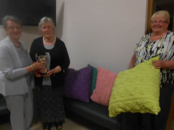 Janette McQuitty with her Arran Cushion and cup. INBM309-14 S