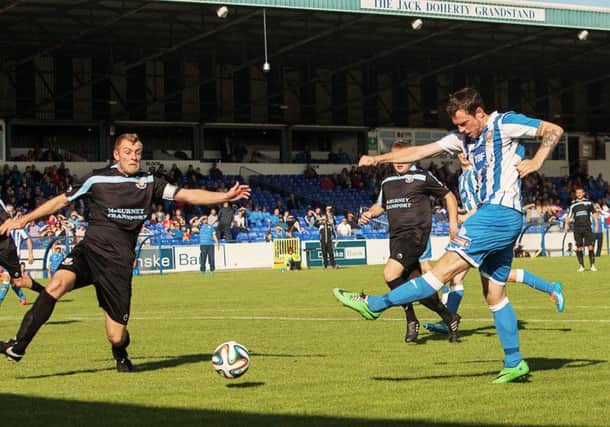Gary Browne hammers home the equaliser for Coleraine in the derby match against rivals Ballymena at the Showgrounds.

photo:Derek Simpson