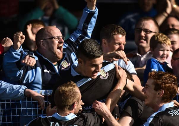 Michael Ruddy celebrates with Ballymena United's supporters after scoring the winning goal in Saturday's win at Coleraine. Picture: Press Eye.