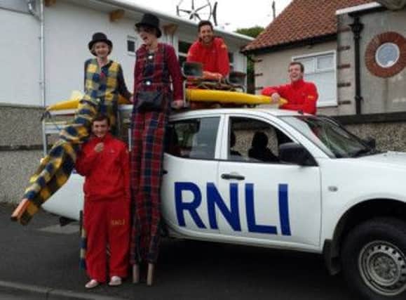 RNLI LIFEGUARDS are excitedly welcomed to Rathlin Sound Maritime Festival. INBM39-14S
