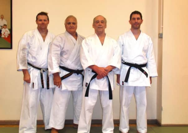Ballymena karate coaches Steven Surgenor, Dan Redmond and Sean Wisener pictured with legendary Sensei Vince Morris (second left).