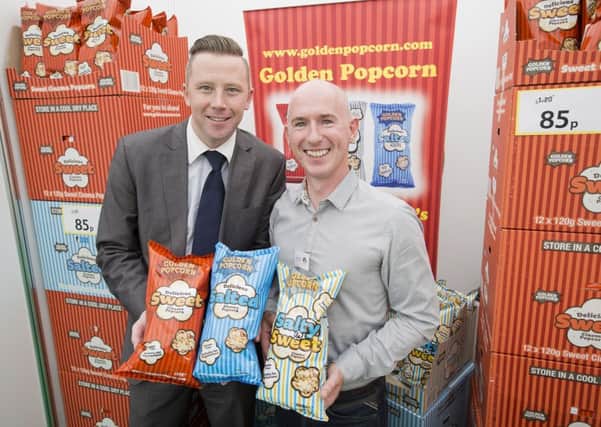 Newtownabbey company Golden Popcorn was among more than 60 food and drink producers which offered the public the opportunity to sample their wares at the annual Tesco Taste Northern Ireland Festival, which was staged at Belfasts Custom House Square and attracted around 20,000 visitors. Steven Murphy, from Tesco, welcomed Philip Morgan, from Golden Popcorn to the event. INNT 39-456-CON