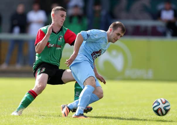 Institute's Stephen Curry shields the ball from Glentoran's Marcus Kane. Picture by Darren Kidd/Press Eye