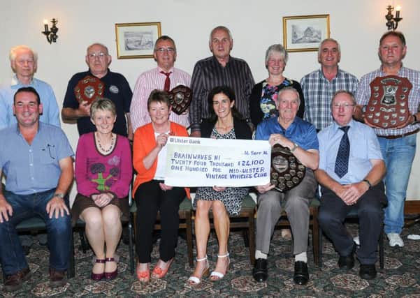 The members of the Mid Ulster Vintage Vehicles Club including chairman Sydney Scott and chairman of the Tractor Trek committee Dennis Bell are pictured as they present a cheque for £24,100 to Sandra McKillop, chairperson of Brainwaves NI and members Christine Devlin and Sylvia Watt. The money was raised by the Mid Ulster Vintage Vehicles Club through their annual Two Day Tractor Trek held in July.