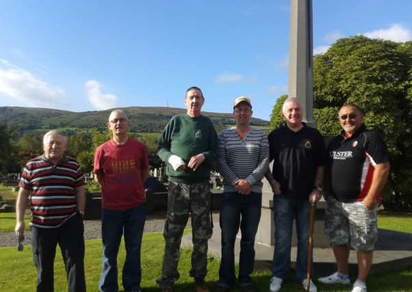 Volunteers at the veterans' grave cleanup in Carnmoney Cemetery with Councillor Robert Hill. INNT-38-711-con