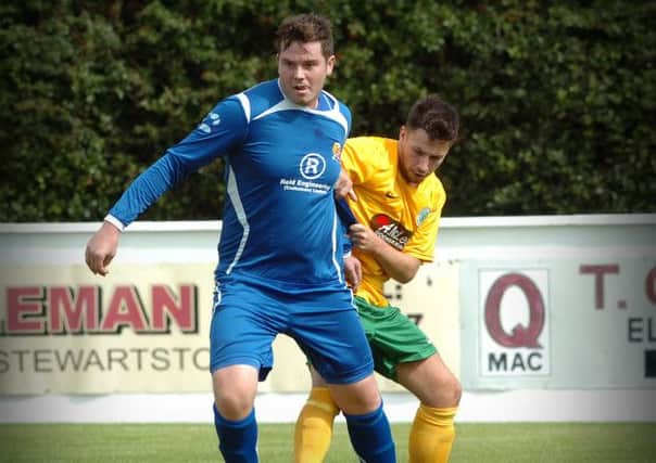 Coagh's Andrew Kelso shields the ball