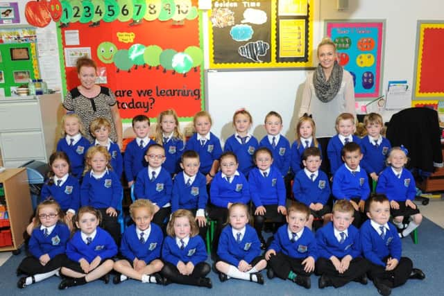 Phoenix Integrated Primary School P1 class of 2014 pictured with their teacher Miss Wilson and classroom assistant Mrs Quinn.
