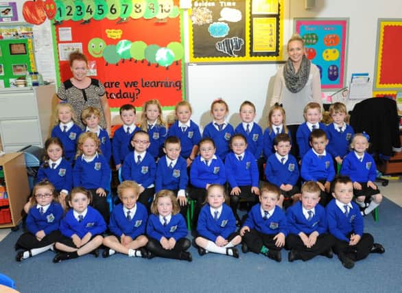 Phoenix Integrated Primary School P1 class of 2014 pictured with their teacher Miss Wilson and classroom assistant Mrs Quinn.