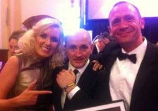 At the Ulster Tatler awards  Barry McGuigan was happy to pose with a Boom Foundation wristband. Also pictured are Founder and Trustee Leona Rankin and Trustee Kent Smith.