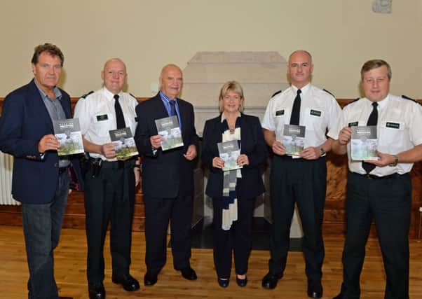 Pictured at the launch of the PSNI scratch and sniff cannabis cards in Larne Town Hall are (from left) Noel Rogan Vice Chair of PCSP, Sergeant Colin Skinner, Michael Lynch Chairman of PCSP, Wendy Carson Manager of PCSP, Inspector Paul Woods and Chief Inspector Stephen McCauley. INLT 40-006-PSB