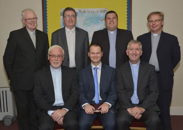 Rev Graeme Orr, seated centre, who was installed as minister at Magheramason Presbyterian Church on Friday evening, pictured with clergy who took part in the service, from left, seated, Rev John Hanna, Moderator of the Presbytery of Derry & Donegal, and Rev Knox Jones, Convenor of Vacancy, standing, Rev Dr Robert Buick, Clerk of Presbytery, Rev Mark Shaw, Rev Keith Hibbert and Rev Craig Wilson. INLS3814-128KM
