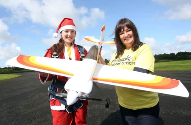 Tamara McErlain (19) from Armoy, pictured with Claire Hogarth from Friends of the Cancer Centre, is taking on the ultimate adrenalin experience for the second year in a row in memory of her brother, Callan, who passed away from Ewing Sarcoma in June 2013 at the age of 16.  Registration for the event is now open so for further information or to sign up to take the plunge, please visit www.friendsofthecancercentre.com or call 028 9069 9393. INBM40-14S