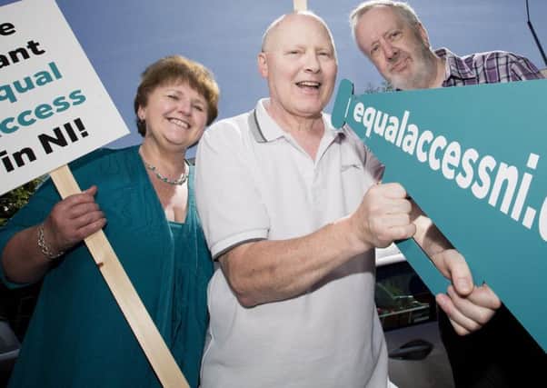 Campaigning are Roisin Foster, Cancer Focus NI, with cancer patients Allister Murphy and Gary Vint (right)  (pic: Brian Morrison photography). INCT 40-703-CON