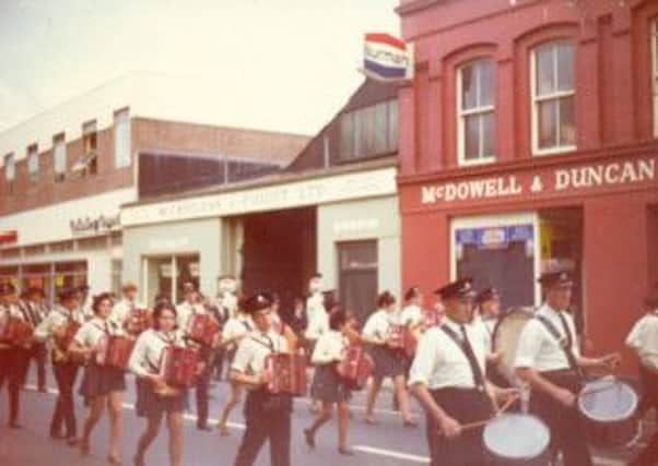 Last parade on Strand Road passing McDowell & Duncan premises, which was latter bombed.