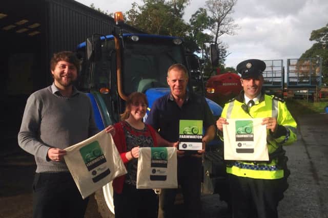 Robert Skelton pictured on his Kilraughts Road farm on Wednesday morning, with Inspector David Anderson Ballymoney PSNI, Michael McCafferty and Cathy Watson from Ballymoney Police and Community Safety Partnership. inbm40-14s