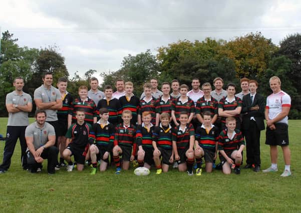 Cambridge House Grammar school rugby team and coaches pictured with Ulster players Andrew Warwick, Ricky Andrew and Luke Marshall. INBT 39-802H