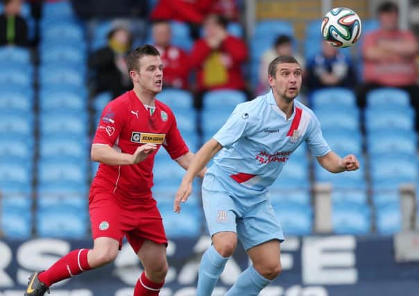 Ballymena United striker Matthew Tipton shields the ball from Cliftonville's Jaimie McGovern during today's Danske Bank Premiership match at the Showgrounds. Picture: Press Eye.