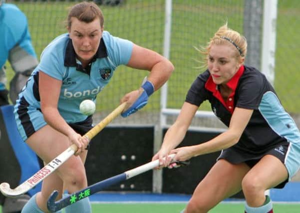 EYE BALL. Ballymoney's Lauren Steen (left), who has given the local side a massive boost by her return to action, pictured during their game with Queens' on Saturday.INBM40-14 049SC.