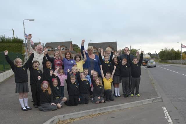 Fair Hill Primary School Vice Principal Mary Spratt  and pupils were joined by Geoffrey Dickson (KRCDA Chair), Cllr Olive Mercer and Cllr Paul Rankin in welcoming the news that Roads Service have approved traffic calming measures in Kinallen, also included is Rebecca Williamson and Angela O'Reilly from mother Hubbards Day Nursery  © Edward Byrne Photography INBL