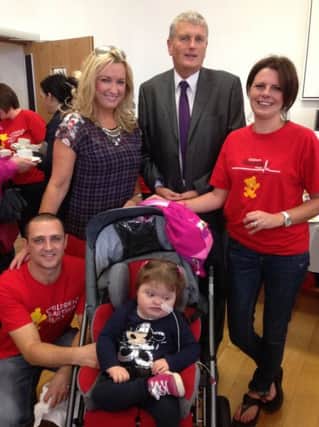 Supporting little Grace McKee's coffee morning for the Children's Heartbeat Trust were newly appointed Health Minister Jim Wells MLA, Jo-Anne Dobson MLA, Grace's dad Aron McKee and Julie Flaherty.