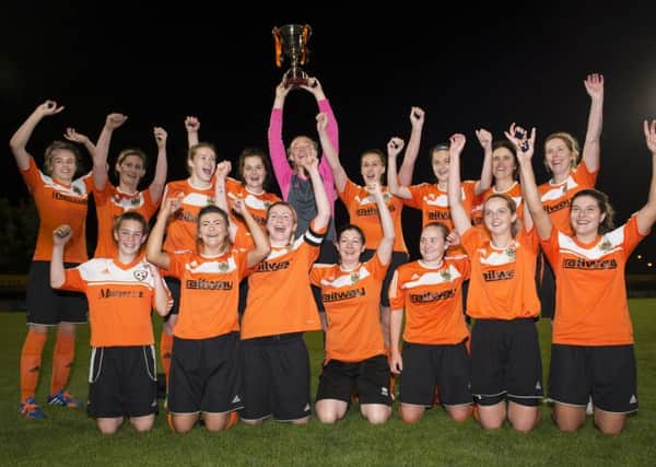 Mid Ulster Ladies celebrate winning the Mid Ulster Cup at Stangmore Park on Friday night