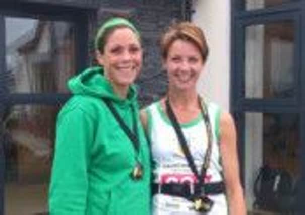 Rachel Lloyd and Claire Oliphant pictured after completing the 26Extreme Causeway Coast Half Marathon. INLT 40-905-CON