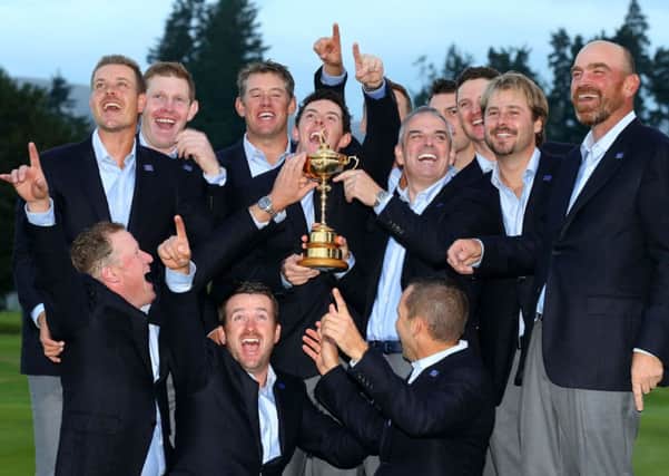 The European team celebrate with the Ryder Cup. ©INPHO/Cathal Noonan