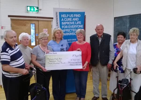Jean McGinley, Lady President of Strabane Golf Club, presents a cheque of £700 raised for the Strabane and Foyle area Parkinson's Fund. 
Included in the picture are: Betty Devine, Caroline McMahon, Laura Smyth, Jack Glenn, Liz McKittrick and Nora Colhoun.