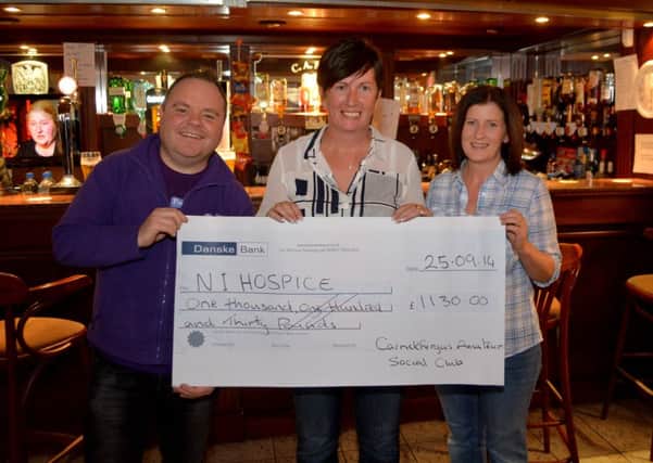John Phillips from the Northern Ireland Hospice with Paula Simms and Mandy Rules from Carrickfergus Amateur Social Club. INCT 40-150-GR