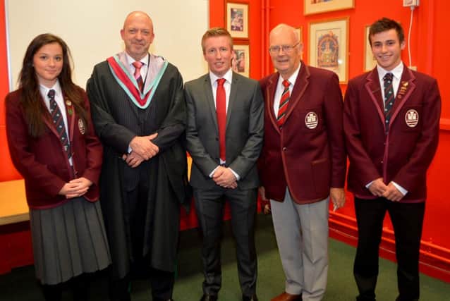 Head girl Ellen McNally, principal Kieran Mulvenna, guest of honour Richard Carberry, chair of the board of governors Dr Gould and head boy Michael Black at Carrickfergus Grammar School awards night. INCT 40-151-GR