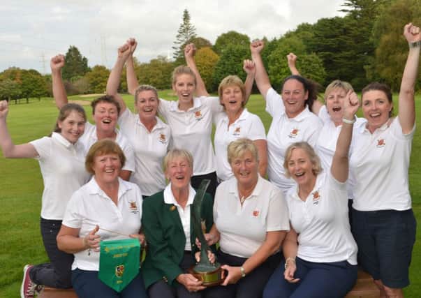 Lurgan players celebrate All-Ireland glory at Monkstown. Back row, from left, are Maeve Cummins, Bronagh McKavanagh, Sian Mulholland, Cara Murphy, Lynne Hanna, Christine Hagan, Fiona McGrady and Orla O'Dowd. Front row, from left, are Sheena McStay (team manager), Pam Graham (lady captain), Diana McClelland (lady president) and Anne Knox. Pic by Pat Cashman.INLM40-199