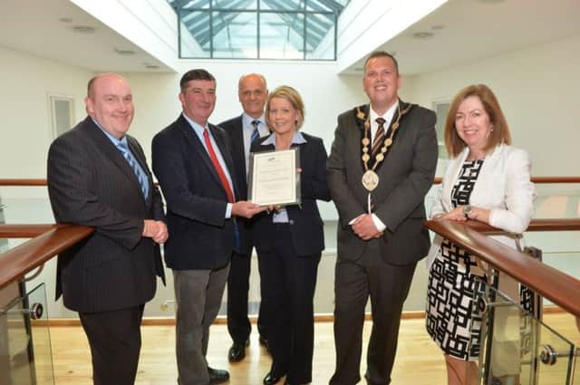 Councillor James Baird, Chair of the Council's Strategic Policy Committee presents Kerrie-Anne McKibbin with her certificate in recognition of being highly commended as Employee of the Year by APSE.  Also present are: (l-r) Alderman William Leathem, Vice-Chair of the Council's Strategic Policy Committee; Jim Rose, Director of Leisure Services; the Mayor of Lisburn, Councillor Andrew Ewing and Dr Theresa Donaldson.