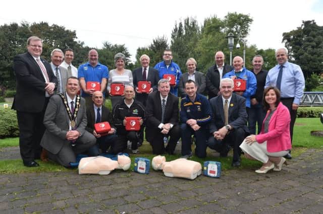 Alderman Paul Porter, Chairman of the Council's Leisure Services Committee (front middle) is pictured with representatives of the local sporting clubs which received a defibrillator from Lisburn City Council; the Mayor of Lisburn, Councillor Andrew Ewing; Kevin Madden, Sports Development Officer; members of the Council's Leisure Services Committee and Jonathan Craig MLA.
