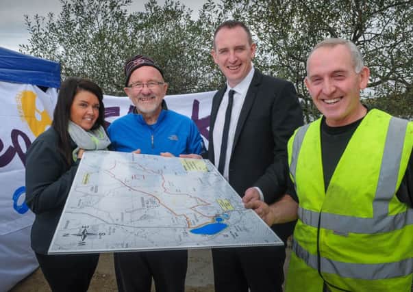 Checking out the route for Sunday mornings Walk Festival in the Sperrins organised by Sperrintrekkers in conjunction with Cookstown Council with the proceeds going to the Mid Ulster Stroke Survivors Club are - Mark McKeown, Tourism officer with Cookstown Council, Derke Short, Cathal mallaghan, vice chairman Cookstown Council and Ivor Paisley, deputy chief executive Cookstown Council.