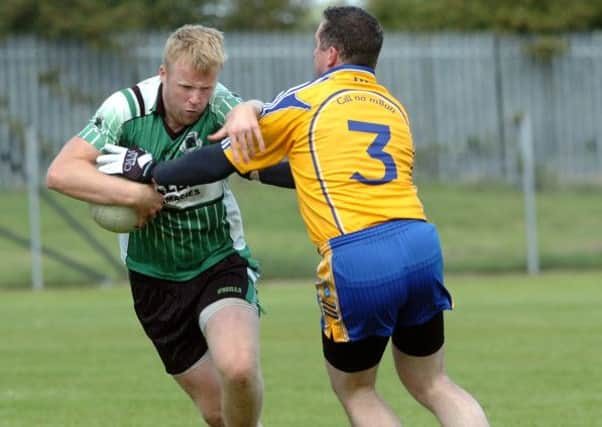 Rock star Conor McCreesh breaks away from Killyman's Colm McVeigh