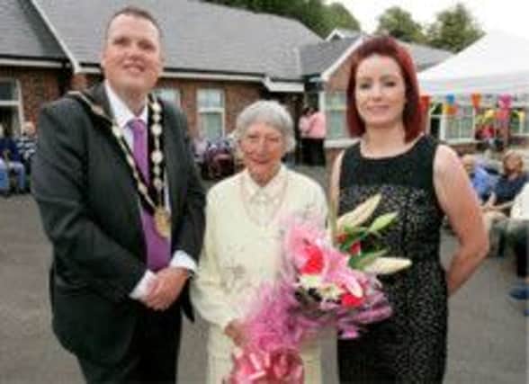 Cllr Andrew Ewing (Mayor of Lisburn), Dinah Chapman first service user and Kelly Devlin, manager.