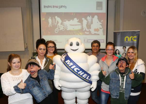 NRC Travel & Tourism students Jucyta, Kladuia, Ebyta and Patricia who attended last week's Routes Road Safety Roadshow, which was held in conjunction with Michelin, are seen here with puppet characters Shifty and Bez Included is Student Liaison Officer  Lesley Anne Beacom and Steve from Routes Road Safety. INBT 41-101JC