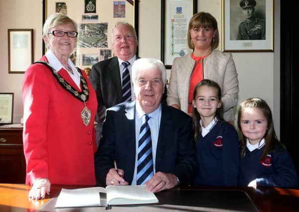 Mayor of Ballymena, Cllr. Audrey Wales, is pictured with former Ballymena United committee members Robert Cupples (Chairman) and Maurice Smyth (vice-chairman) at a special reception in The Braid, marking their time at the club. Included is Roberts daughter Andrea Pennie, and grandchildren Hanna and Ellie. INBT41-202AC