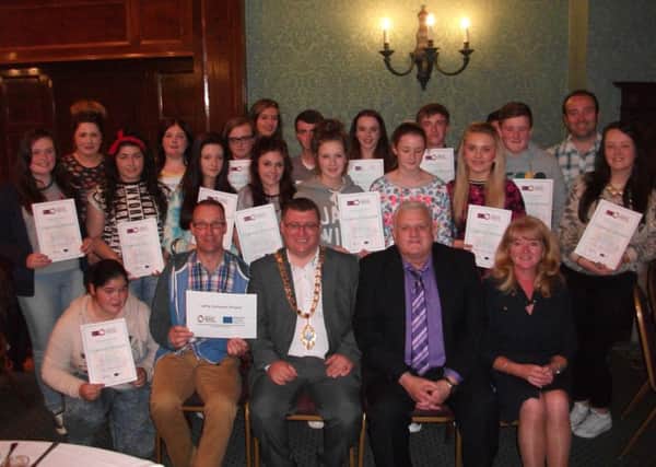 Some of the participants who took part in the Larne Cohesion Project pictured with their certificates. Also pictured is Larne Mayor, Councillor Martin Wilson, Chair of the North East PEACE III Partnership, Bill Adamson and Larne Borough Council CEO, Geraldine McGahey.  INLT 41-677-CON