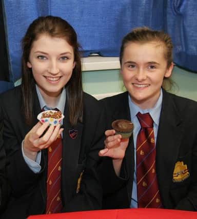 Tasty treats for Becca Crossett and Gemma McArthur at the Macmillan coffee morning in Downshire School. INCT 41-750-CON