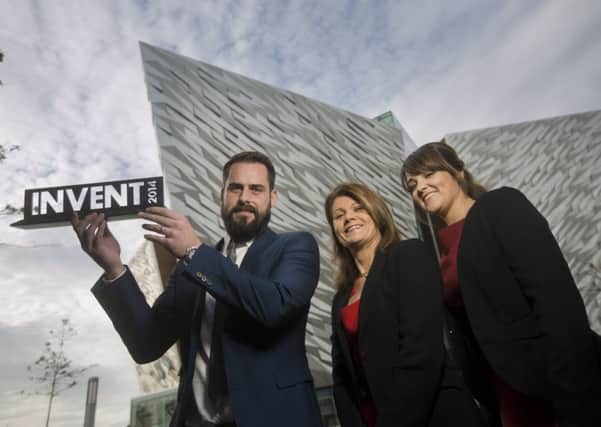 Sean and Leona McAllister of Plotbox lift the INVENT 2014 trophy at Titanic Belfast. They are congratulated by Julie- Ann O'Hare of the awards sponsors, Bank of Ireland UK.
Picture by Brian Morrison.
