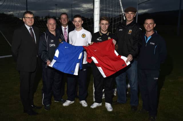 Cathal Connolly and Cormac Lawlor, who received the Bertie Peacock Award. The boys are pictured with their respective team managers, Damian McNamee (Co. Londonderry Premier team) and Stefan Seaton (County Antrim U-15s), together with Roger Dallas and Frankie Trainor, trustees of the Bertie Peacock Foundation and William Moore, from the University of Ulster who help administrate the award. (s)