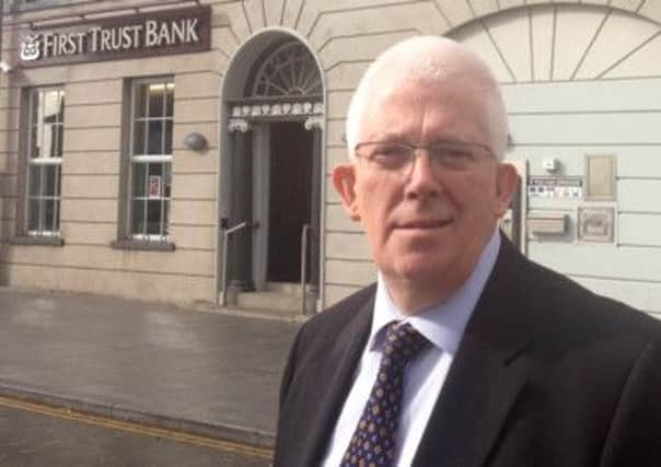 Alliance MLA Stewart Dickson at the First Trust Bank in Carrick. INCT 41-758-CON