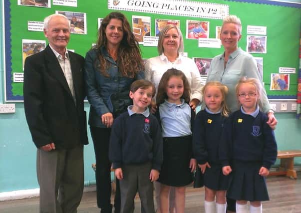 Lindsay Peacocke, chairman of the Board of Governors, Wendy Nesbitt, Grange of Mallusk Steering Group, acting principal Susanne Kinsella and Kate McVeigh, Board of Governors, with pupils Jamie (6), Keisha (6), Lucy (5) and Sophie (5) at Mallusk Primary School. INNT 41-510CON