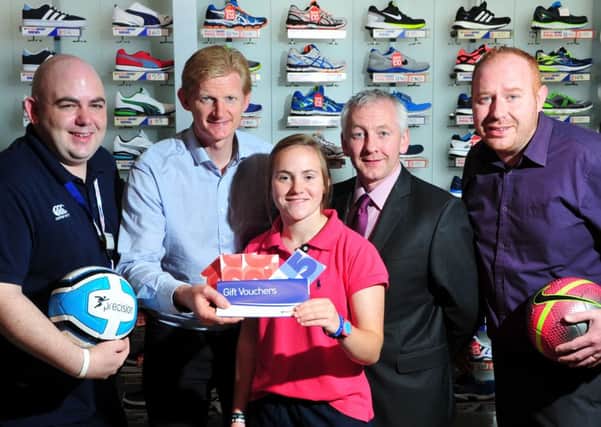 John McConnell of McConnell's Intersport Cookstown hands over the winning vouchers to  Samantha Kelly who is the  Mid-Ulster Mail & Tyrone Times Sports Personality for the month of September Included in the picture are Gerard McSloy (Store Manager), Noel Loughrin (Ulster Bank) and Patrick Cullen (Mid-Ulster Mail & Tyrone Times Advertising Team Leader).INTT4114-357