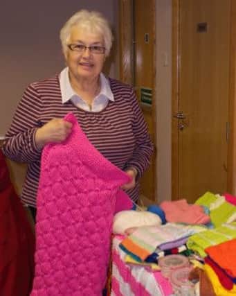 Dorcas Group member Jean McCauley with some of the items the group has made
