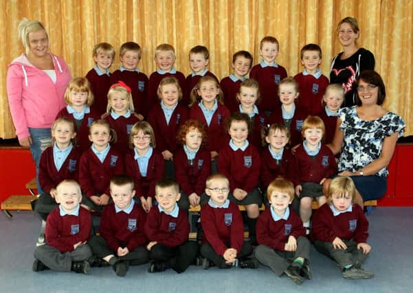 Happy smiles from the P1 class at Randalstown Central PS along with teacher Mrs. Janet McKane and classroom assistants Evelyn Speer and Amy McErlaine. INBT40-758AC