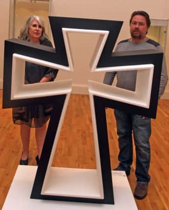QUESTION. Artist Derek Ferguson-Smith, pictured at his Exhibition,  Alpha - A Question of Answers - at Ballymoney Museum on Saturday along with his wife Siobhan.INBM41-14 023SC.