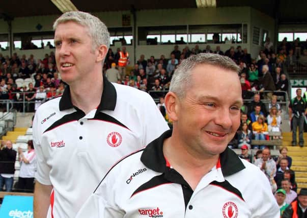 Tyrone manager Mickey Donnelly and assistant manager Kieran Mc Hugh breath a sigh of relief at the final whistle. INTT3012-712DCA