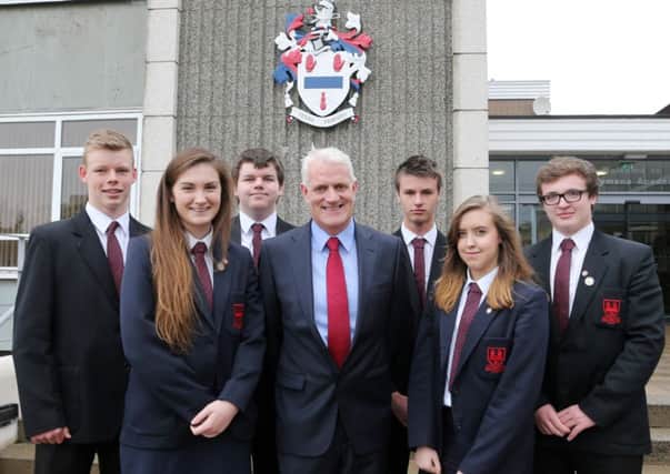 Ballymena Academy students who were achievers in Northern Ireland in their GCSE exams. Seen here with school principal Mr Black are, L-R, Andrew Hogg (1st in Construction), Sarah McLean (3rd in Double Award Science and joint 3rd in Religious Studies), David Dunlop (joint 3rd place in Additional Mathematics), Stefan McLees (joint 2nd in Economics), Rebecca McCaw (joint 2nd place in Economics), Michael Knowles (joint 1st in Biology). INBT 41-112JC